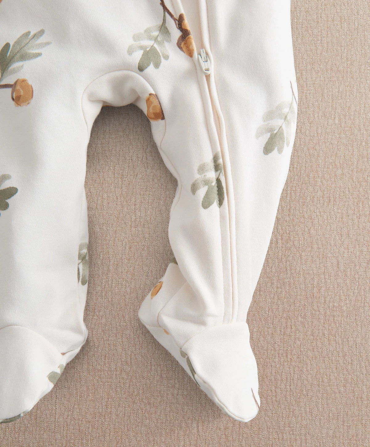 White acorn & leaf print zip-front all-in-one with footed legs