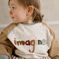 Raglan sweatshirt with 'imagine' logo on speckled white front, beige sleeves, gray collar
