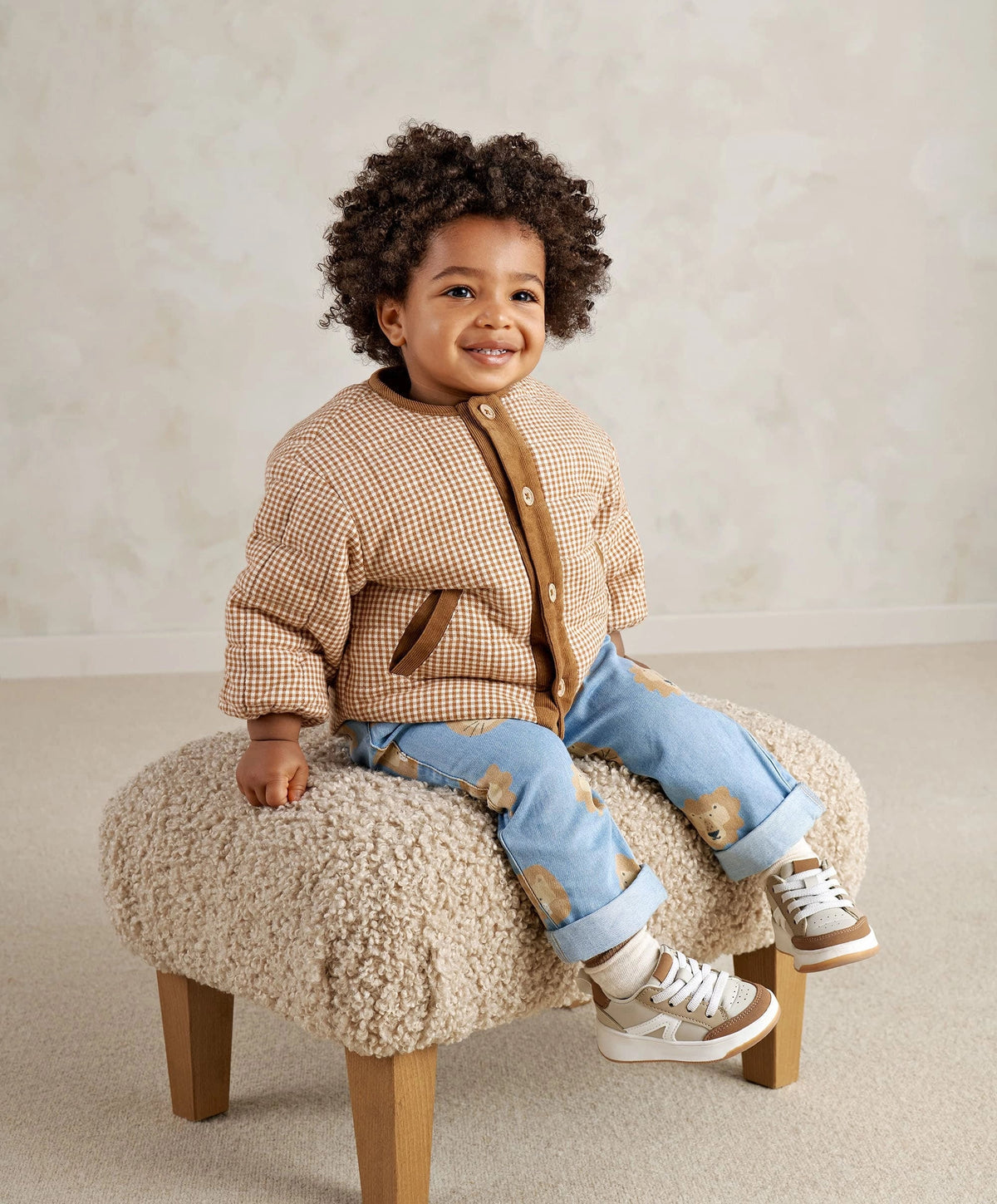 Checked jacket with brown corduroy trim and snap front worn by child