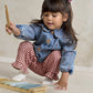 Light blue denim jacket with button front and embroidered motifs, child seated
