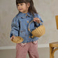 Light blue denim jacket with button front and embroidered motifs, child holding woven baskets