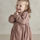 Red and white gingham long-sleeve dress with ruffled collar and gathered waist