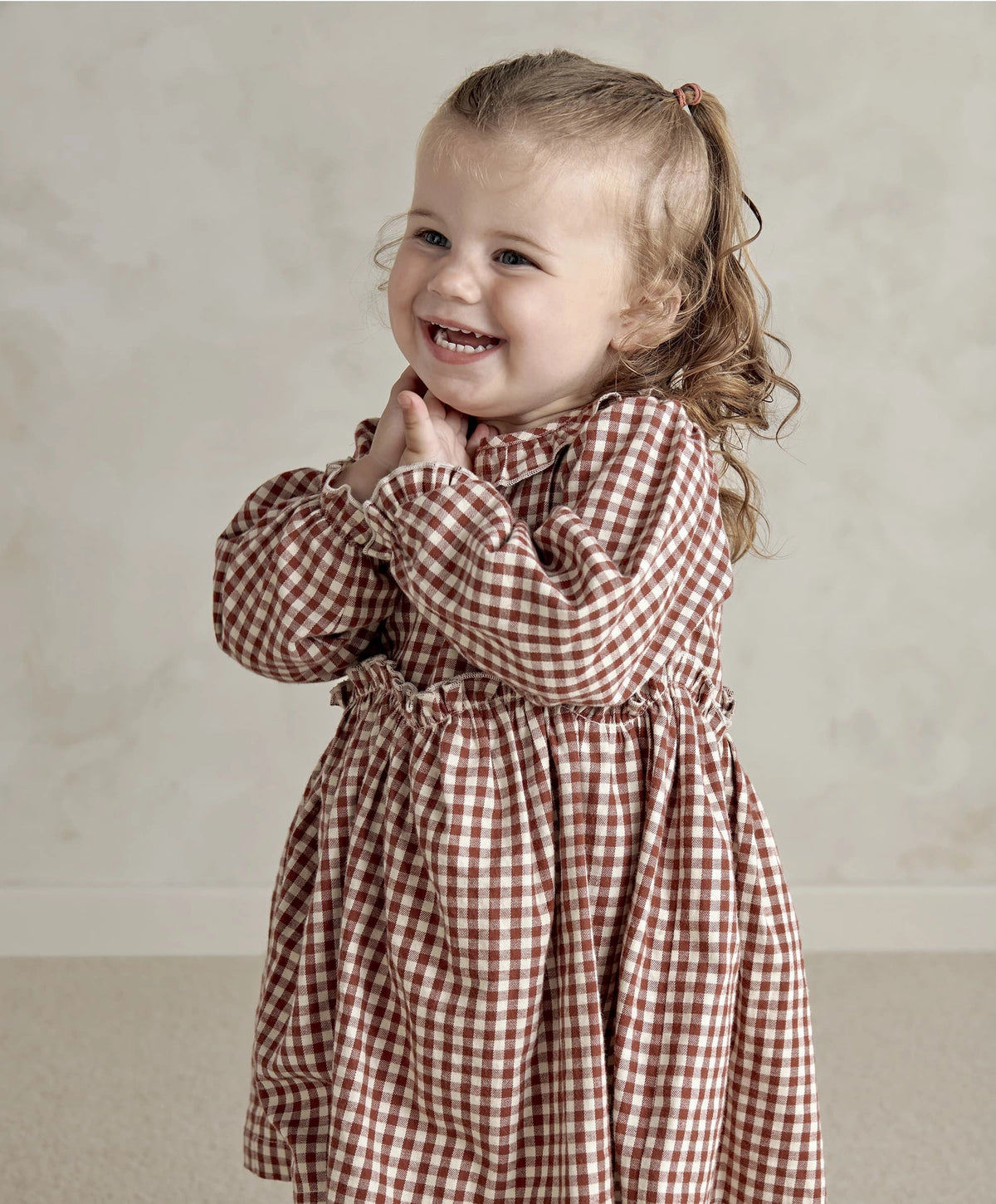 Red and white gingham long-sleeve dress with ruffled collar and gathered waist