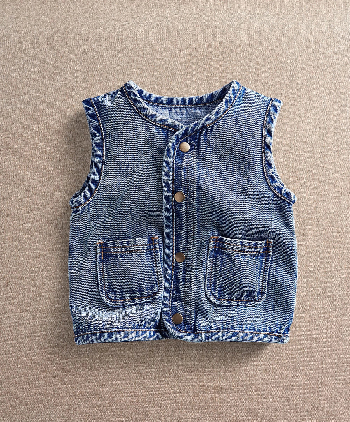 Blue denim sleeveless gilet with button front and two chest pockets