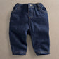 Relaxed-fit dark blue jeans with elastic waist and cuffed hems