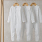 White long-sleeve sleepsuits, snap-button front, hanging pack of three
