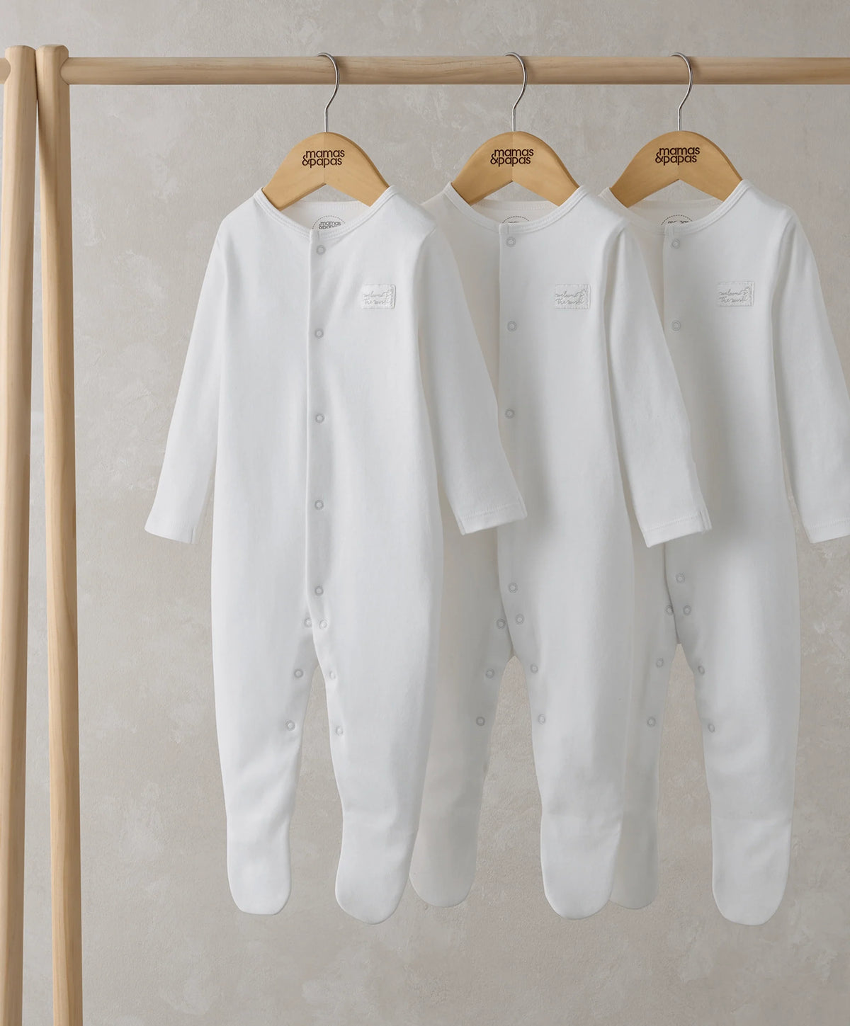 White long-sleeve sleepsuits, snap-button front, hanging pack of three