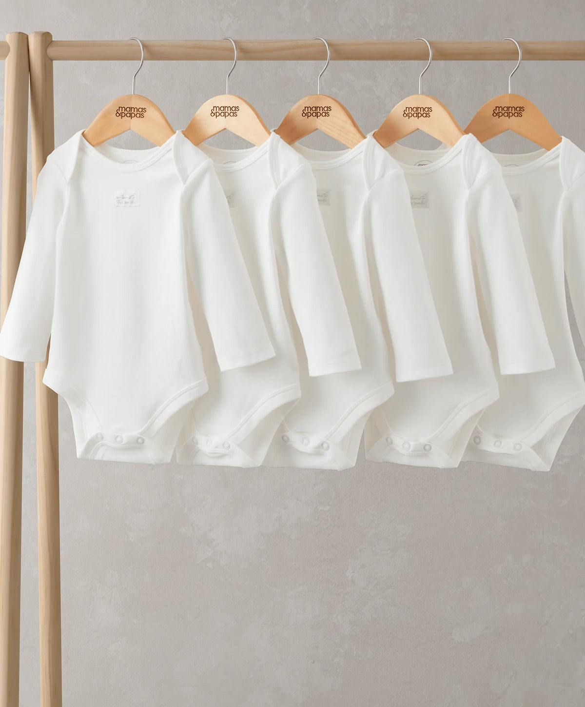 White long-sleeve bodysuit 5-pack on hangers, round neck and snap crotch