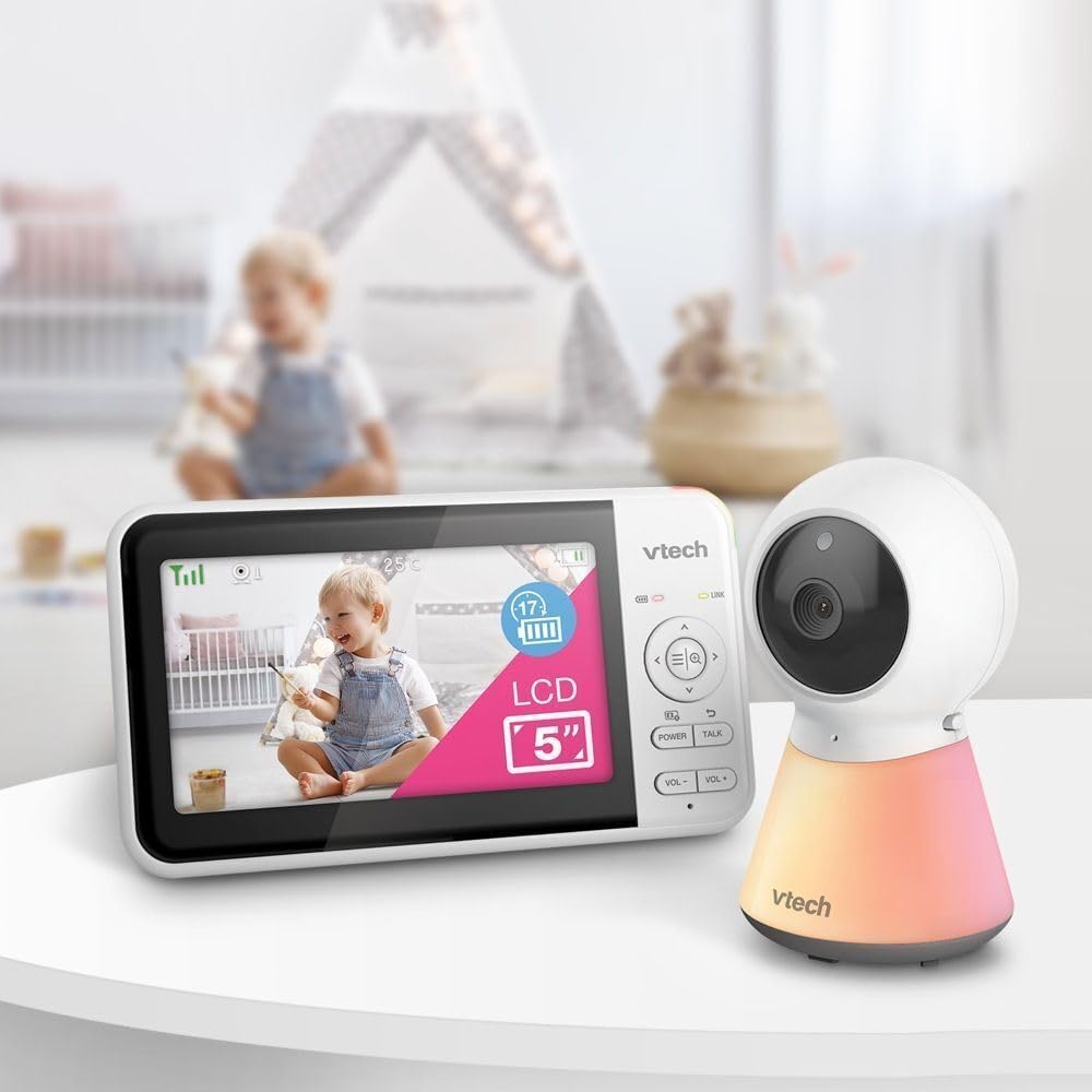 Baby monitor with 5-inch screen showing live view and white camera on standing base
