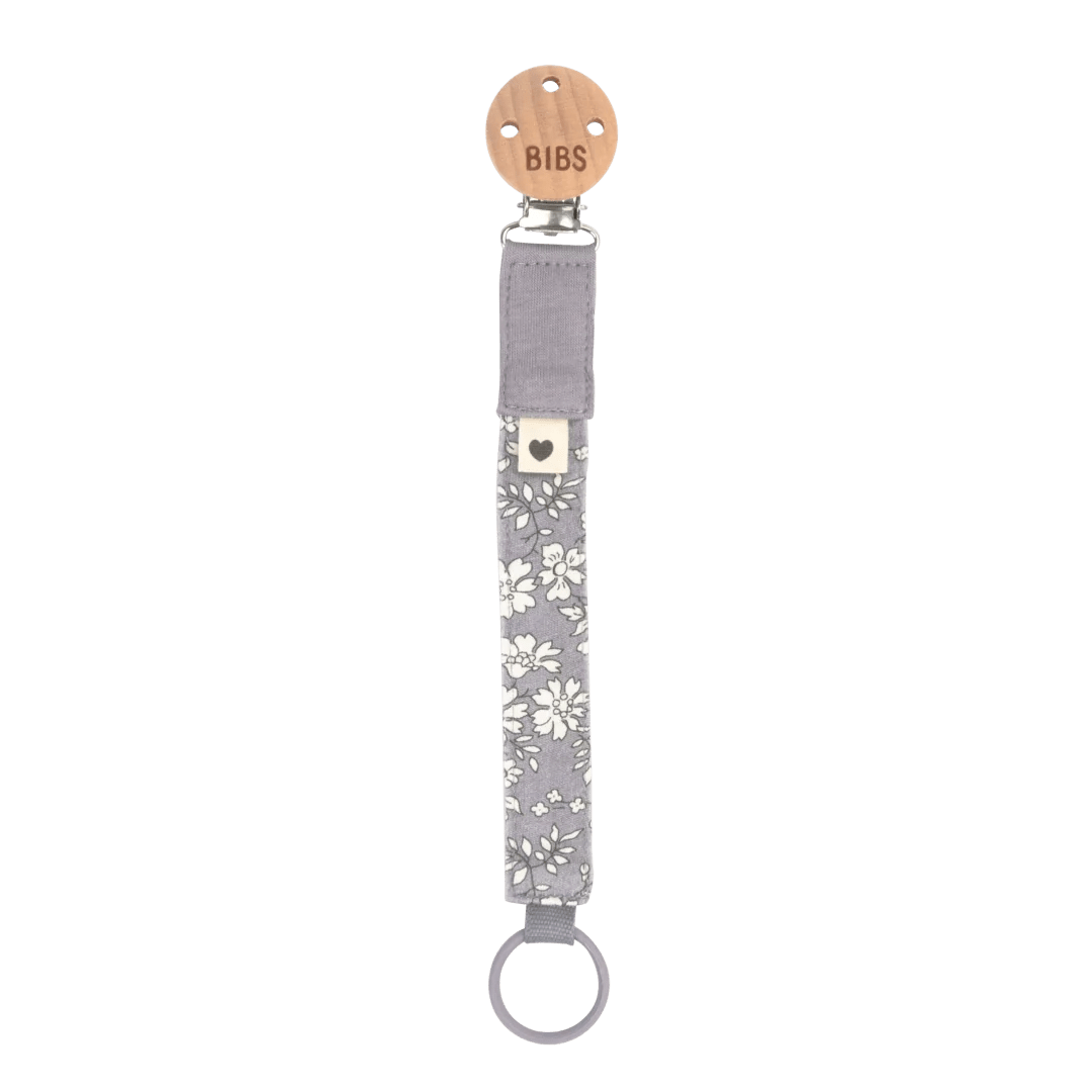 Grey floral pacifier clip with round metal ring.