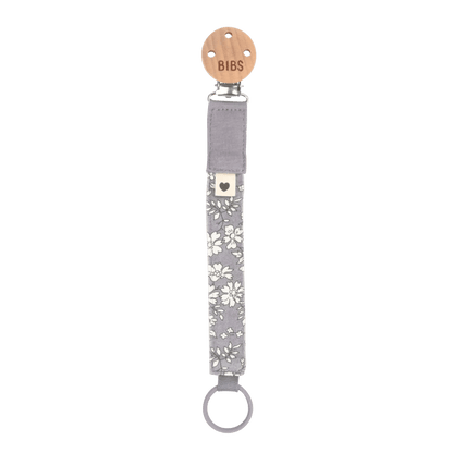 Grey floral pacifier clip with round metal ring.