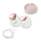 Breast pump spare parts kit with twin pump parts, tubing, and pink membrane caps