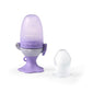 Purple baby food feeder with flower-like handle and protective fruit-teether cap