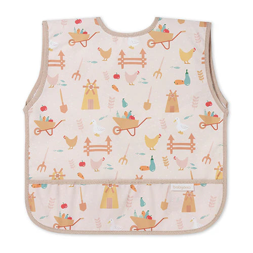 Light pink kids’ apron with colorful farm icons and front pocket