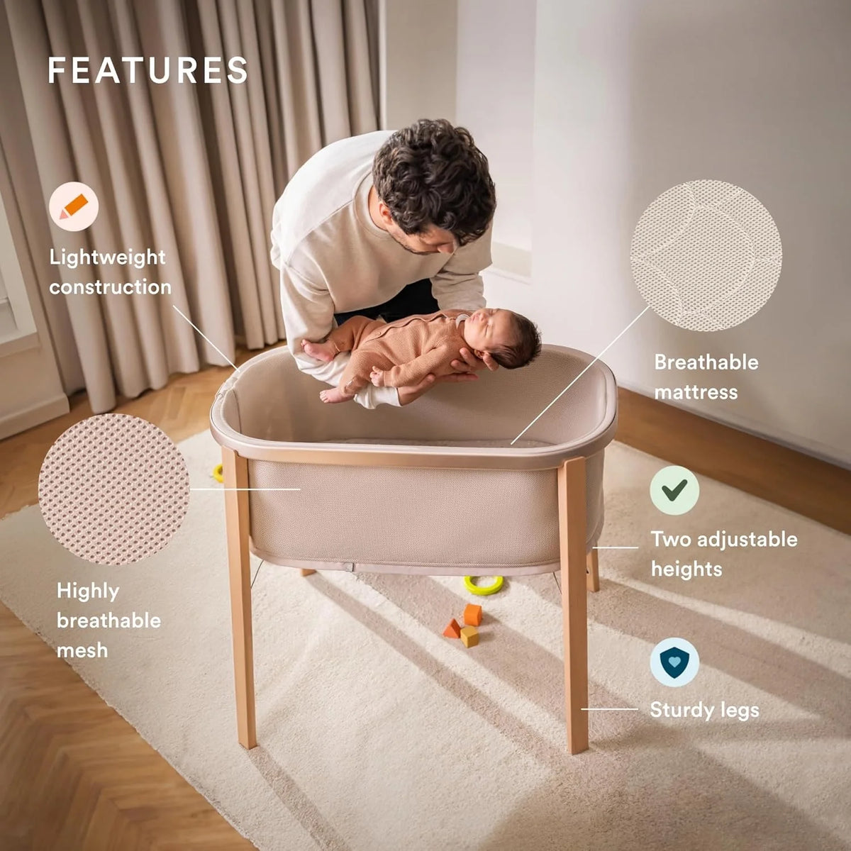 Snoozi bassinet in sandy beige with caregiver leaning over baby inside