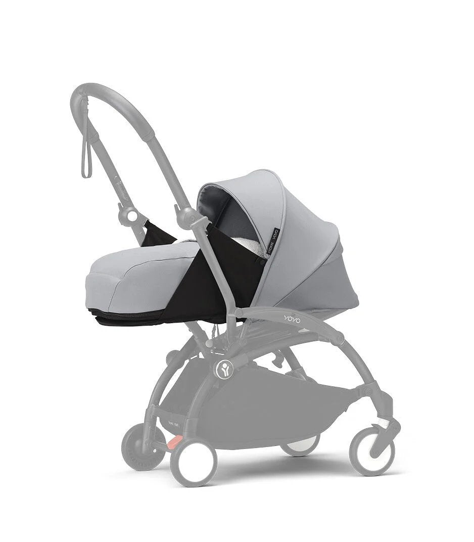 Newborn stroller pack with light gray carrycot and seat, gray frame, front wheels