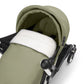 Newborn stroller seat in olive fabric with plush white insert and canopy