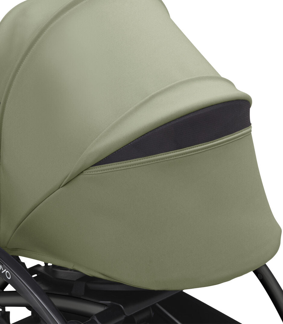 Olive stroller canopy with dark bottom trim and stitched padded shell