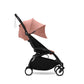 Yoyo³ stroller with blush pink canopy and black frame, front view with wheels
