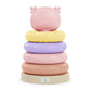 Folding sensory pyramid toy with stacked pads and pink head on top