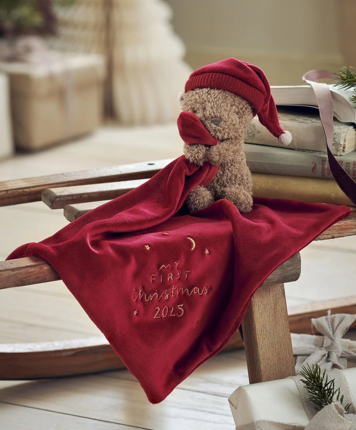 Red teddy bear comforter with plush bear and My First Christmas 2025 embroidery