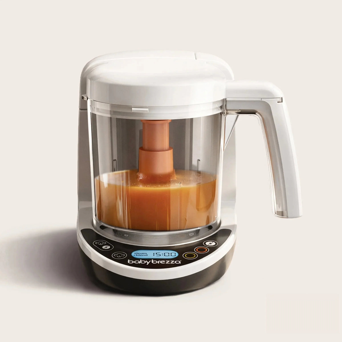 Baby food maker with clear blending container and orange puree inside