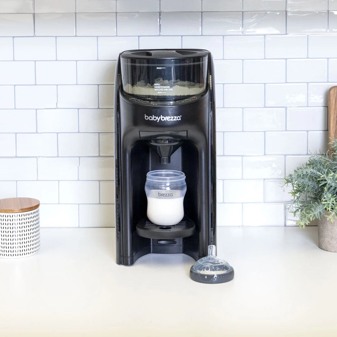 Black babybrezza formula dispenser with bottle and base platform