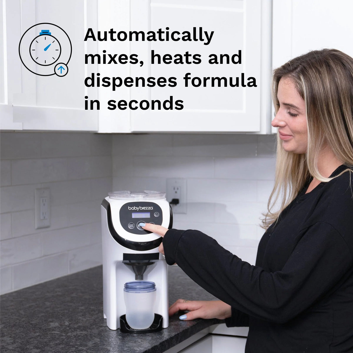 White formula dispenser with bottle under spout next to a hand on the controls
