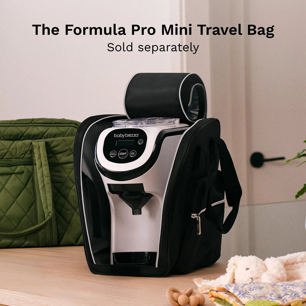 White babybrezza formula dispenser inside a black travel bag