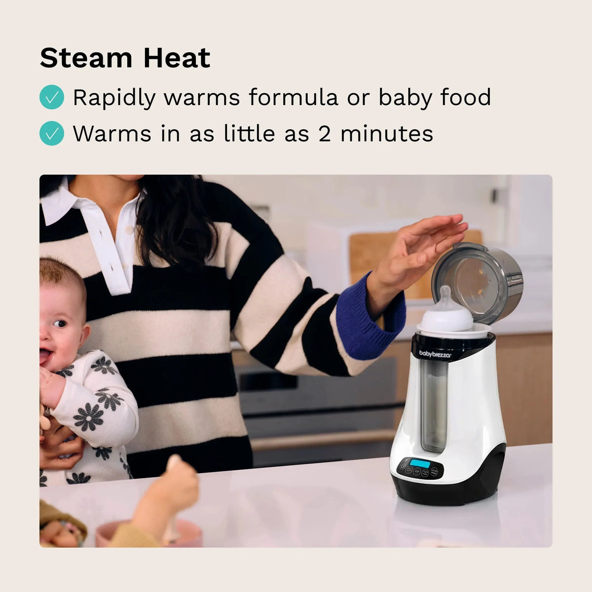 Baby Brezza warmer on countertop with bottle in chamber; caregiver preparing feed