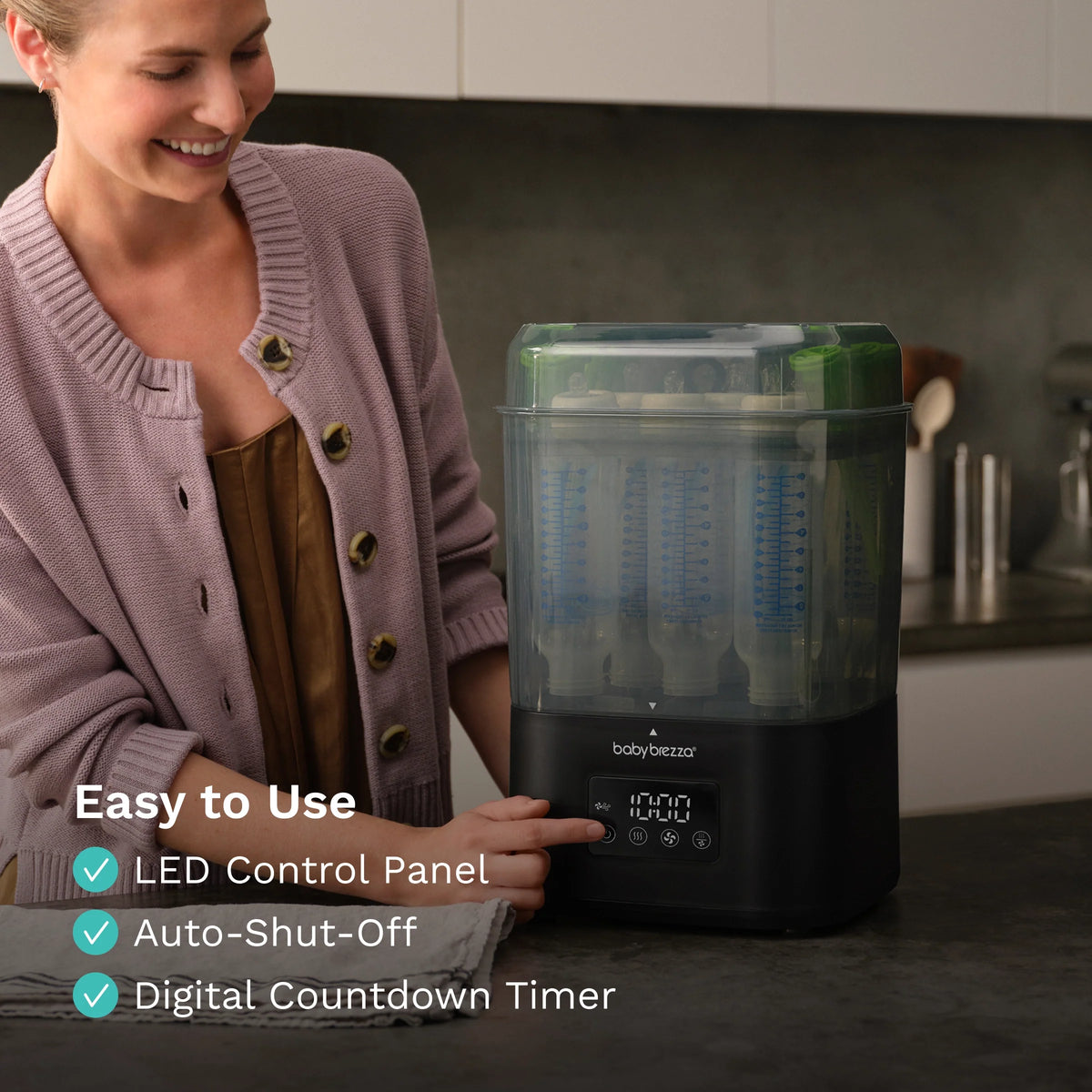 Baby bottle sterilizer dryer with LED control panel and digital timer on black base