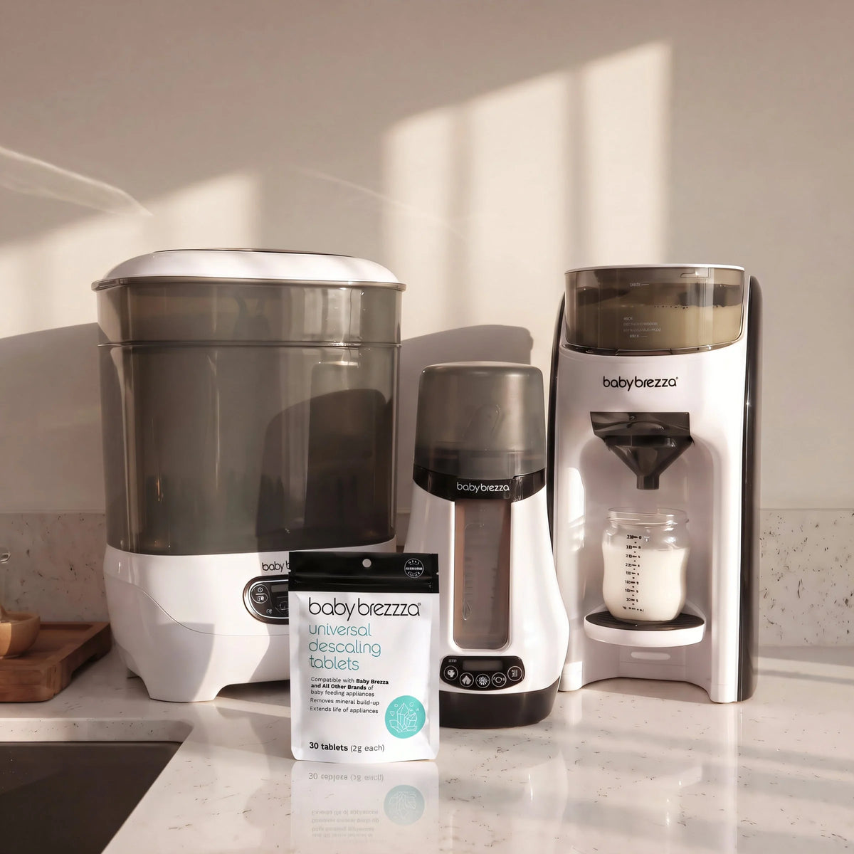 Kitchen countertop with bottle washer machines and universal descaling tablets pouch.
