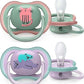 Two pacifiers with cat and dog animal designs, mint and lavender shields