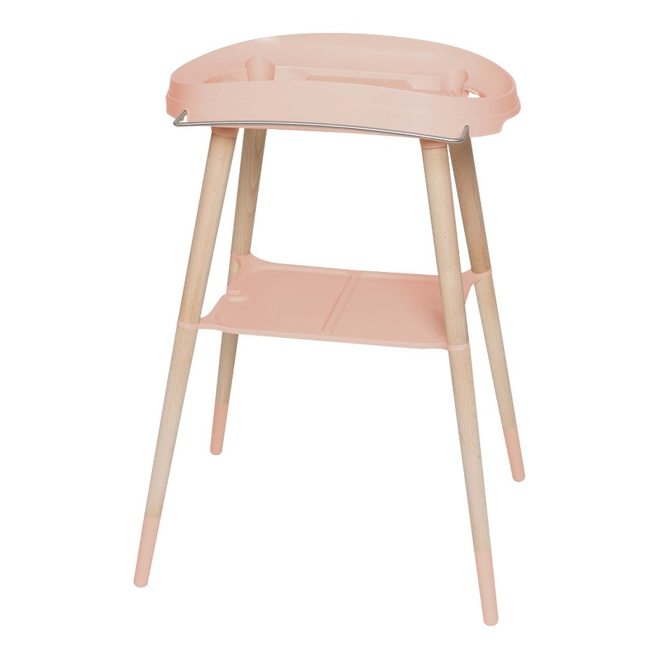 Pale pink bath stand with two-tier tray and molded seat, light wood legs