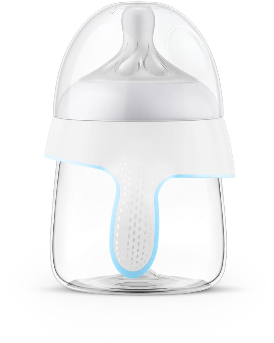 Trainer cup with clear body, white lid, blue rim and soft vented nipple
