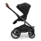 Black stroller with multi-position seat and canopy, standing in studio view.