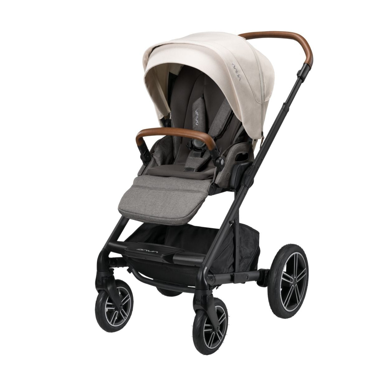 MIXX Next stroller with light beige canopy and gray seat liner, brown handle accents.