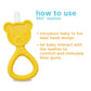 Yellow silicone teddy-bear teether with white bristle tip and raised grip bumps