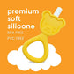 Yellow teddy-bear silicone teether with white bristle tip and textured ring