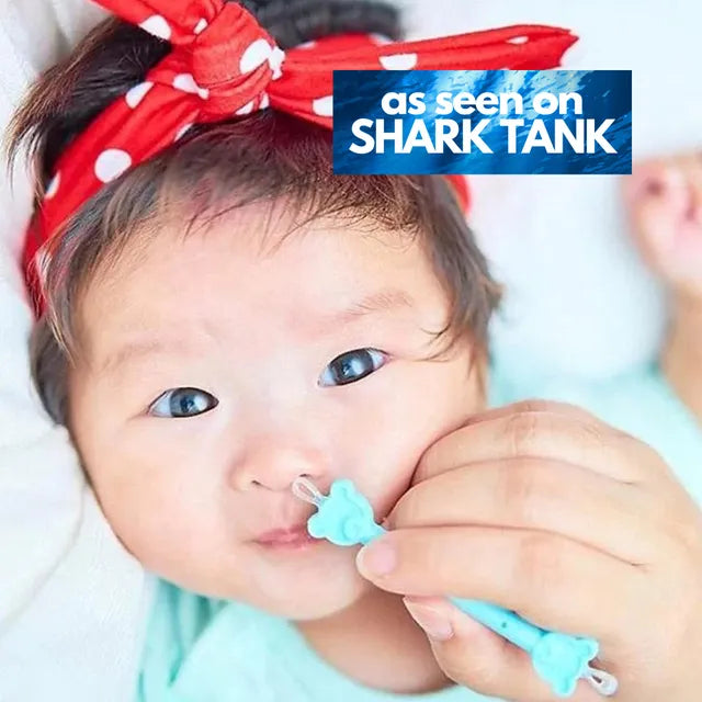 Blue baby nasal and ear cleaner tool held to infant nostril