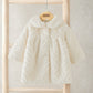 Cream faux fur coat with fluffy collar, chevron knit-like texture, long sleeves