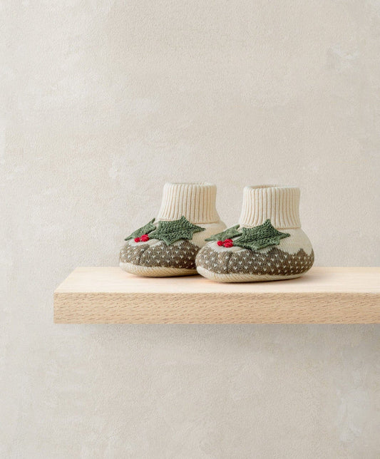 Knit baby booties with white cuff, green tree print and red berries, brown speckled toe