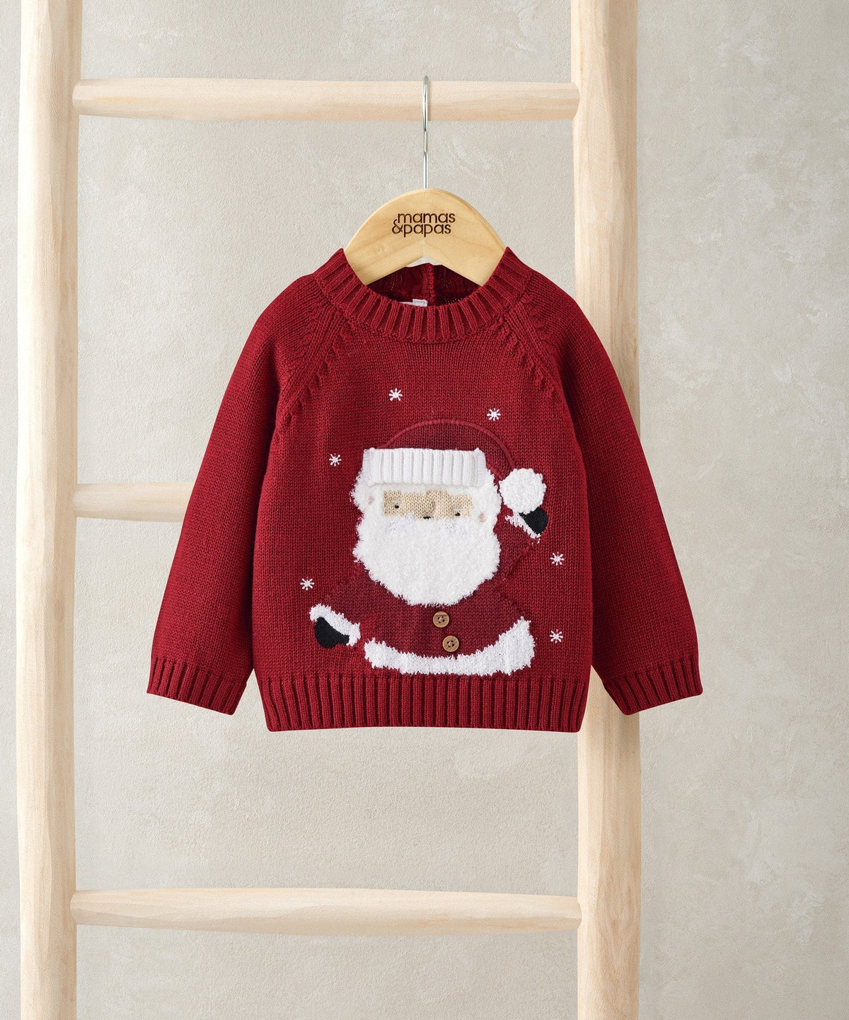 Red knit Christmas jumper with Santa graphic on front, long sleeves, ribbed crew neck
