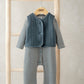 Striped romper with blue quilted vest and front snap closure
