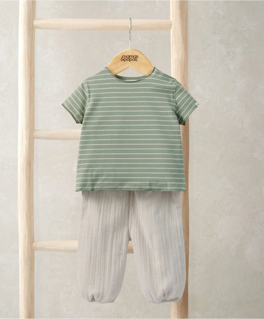 Outfit set on hanger: green-and-white striped tee and cream loose trousers