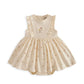 Cream mock skirt romper with gathered skirt and floral chest applique
