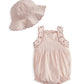 Matching light pink sun hat and baby romper set with scalloped trim and gathered waist