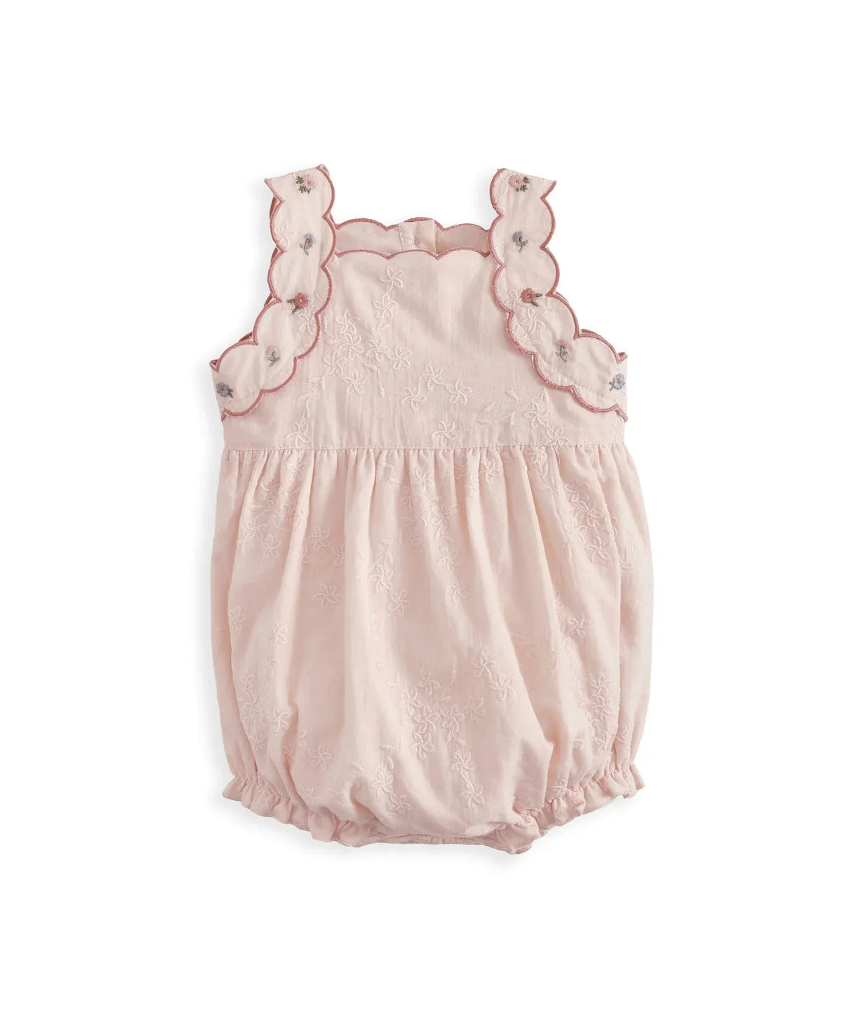 Light pink baby romper with scalloped trim, ruffled bodice, and gathered waist