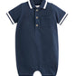 Navy jersey polo romper with striped collar, three buttons, and chest pocket