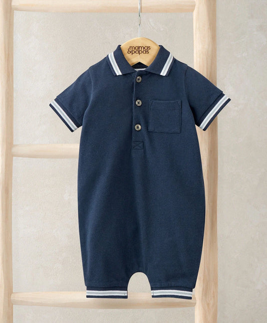 Navy jersey polo romper with button placket, chest pocket, and striped collar